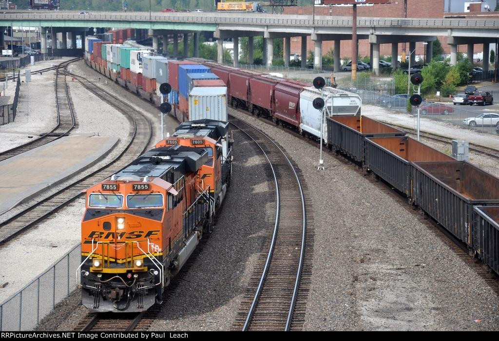 Stack train races east through the station